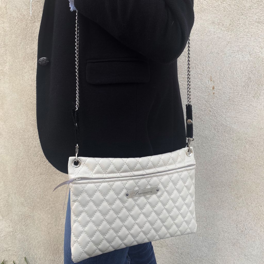 sac pochette chanel trousse en cuir matelasse